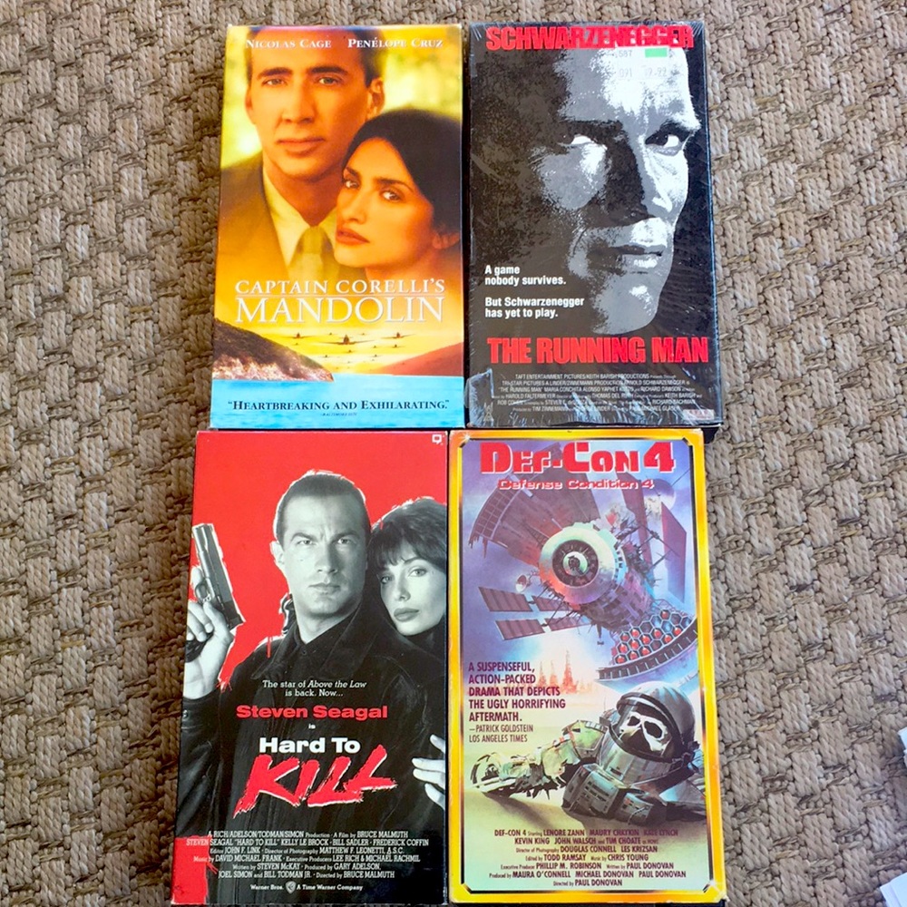 VHS the running man, def con 4, hard to kill, capt corelli’s mandolin